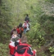 Youth hiking on trail